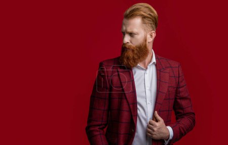 Formalwear. Tux man in formalwear isolated on red. Redhead man in formalwear tuxedo. Man wear elegant formal menswear. Elegance of bearded gentleman in formal suit. Copy space.