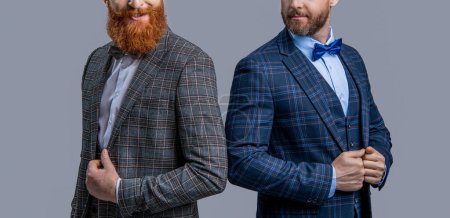 Two businessmen at business event. Tuxedo men in menswear isolated on grey. Tuxedo men in menswear. Tuxedo men wear menswear fashion. Elegant men in formalwear with bowtie. Cropped view.