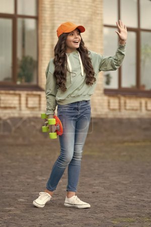 Photo for Teen girl with skateboard outside, hello. teen girl with skateboard at the street. photo of teen girl with skateboard, skateboarding. teen girl with skateboard outdoor. - Royalty Free Image