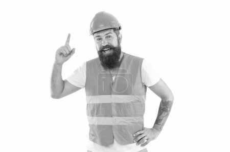 inspired with idea supervisor man in uniform. bearded supervisor man in orange vest. studio shot of supervisor man wearing helmet. supervisor man isolated on white background.