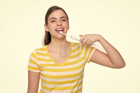 glad young girl with toothbrush isolated on white background.