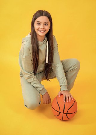 sport school activity. teen girl with basketball ball on court. school basketball player. sport motivation. sport and hobby. girl on phisical training lesson. back to school.