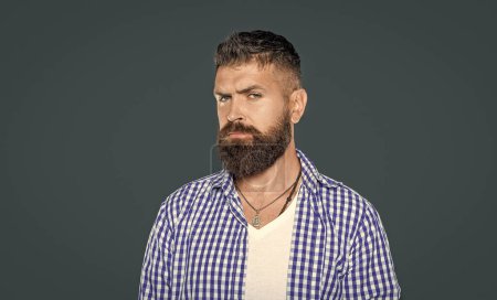 charismatic bearded guy wear checkered shirt on grey background.