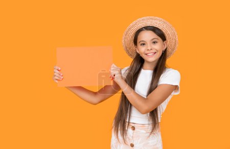 cheerful teen girl with copy space on orange paper on yellow background.