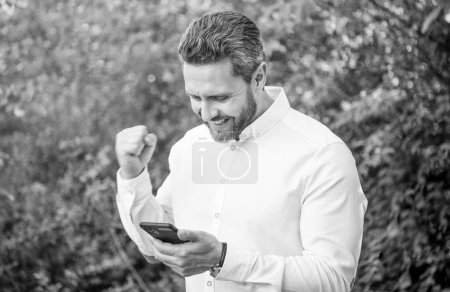 successful marketing businessman with phone. marketing businessman with phone outdoor. marketing businessman with phone work online. photo of marketing businessman with phone.