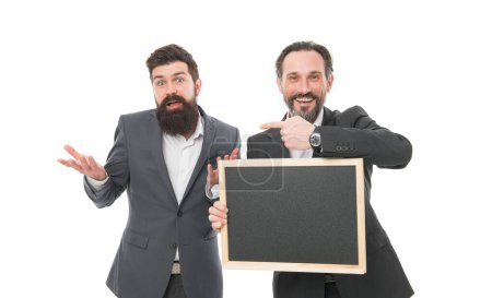 Who knows. Coaches hold blackboard pointing finger isolated on white. Professionally trained coaches. Bearded men back to school. Business coaches. Coaching course. Career coaches, copy space.