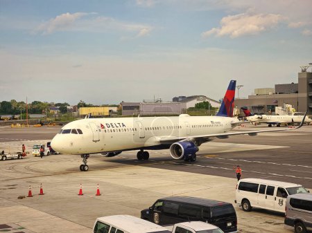 Photo for New York City, USA - May 12, 2023: delta airways plane in laguarda airport terminal before flight. - Royalty Free Image