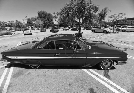Photo for Los Angeles, California USA - March 28, 2021: red chevrolet impala retro car up side view. - Royalty Free Image
