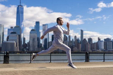 Athlete man running outdoor. Sport running morning exercise. Man runner training in Manhattan. Sport athlete man running in New York city. Sport routine.