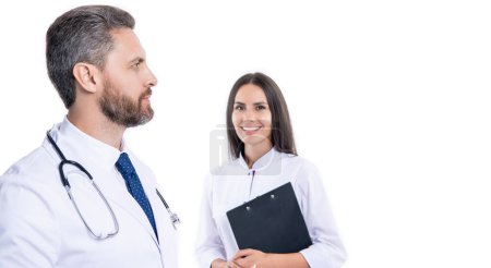 doctor hold medical prescription. doctor internist with clipboard isolated on white. prescriber physician with nurse. prescription. medicine and healthcare. doctor at hospital. copy space banner.