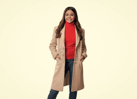Trendy and stylish teenage girl wearing autumn fashion coat.