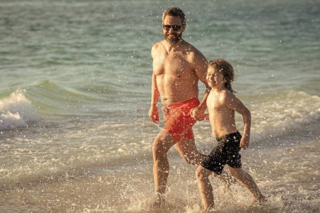 Daddy and son running in sea beach. Father son child bonding enjoying summer vacation. Special moments between daddy and son at sea. Father son kid bonding relationship. horizons on summer vacation.
