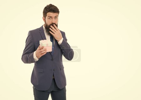 Photo for Unexpected surprise. success and reward. boxing day. Delivery company business. happy birthday shopping. bearded man hold valentines present. businessman in formal suit on party feeling unexpected. - Royalty Free Image
