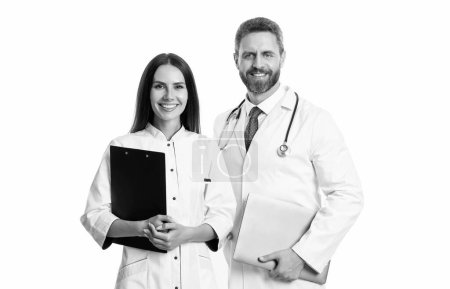 cheerful internist and doctor with laptop and anamnesis. doctor and internist isolated on white background. doctor with internist in studio. photo of doctor and internist wear white coat.