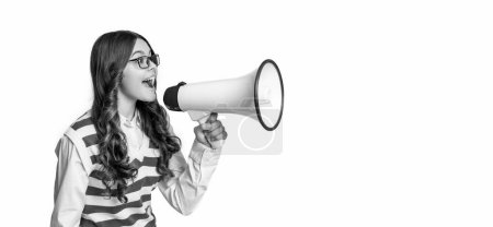 photo of teen girl announcer with megaphone, advertisement. teen girl announcer isolated on white. teen girl announcer in studio. teen girl announcer on background.