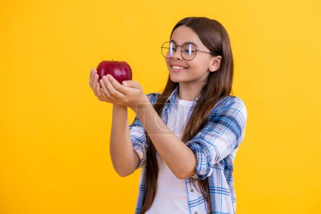 childhood health. natural vitamin for teen girl. teen girl eating healthy food. teen kid girl hold apple. healthy food. Fresh apple for teen girl. Healthy food and vegetarian diet. Refreshing snack.