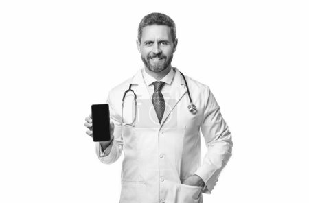 happy medical man show telehealth isolated on white. medical man show telehealth in studio. medical man show telehealth on background. photo of medical man show telehealth on phone screen.