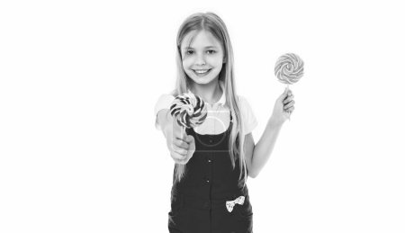 happy teen girl with yummy lollipop isolated on white. teen girl with yummy lollipop in studio. teen girl with yummy lollipop on background. photo of teen girl with yummy lollipop.