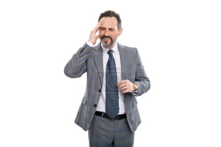 Headache and eye strain on laptop. Chronic headache. Migraine from overwork, deadline. Business man in suit with headache. Businessman has stress. Mature businessman in suit isolated on white.
