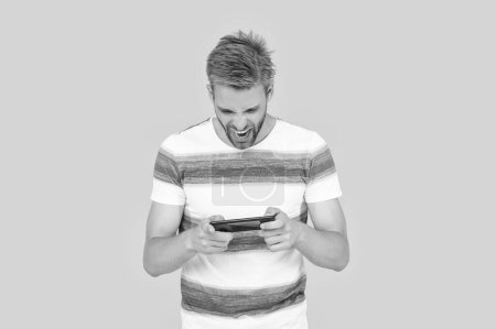 Photo for Angry man has phone communication. digital communication of man with phone. man uses phone to text or message making communication easy and convenient. man uses phone to make effective communication. - Royalty Free Image