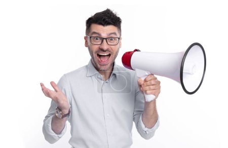 photo of surprised man announcer with megaphone. man announcer with megaphone isolated on white background. man announcer with megaphone in studio. shouting man announcer with megaphone.