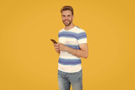 Photo for Digital communication of positive man with phone. man uses phone to text or message make communication easy and convenient. man uses phone to make effective communication. man has phone communication. - Royalty Free Image