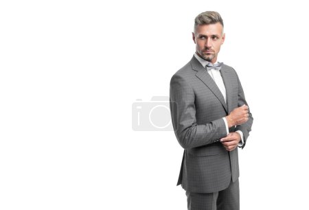 Téléchargez les photos : Confident businessman in blue tuxedo suit with neck bow isolated on white background. - en image libre de droit