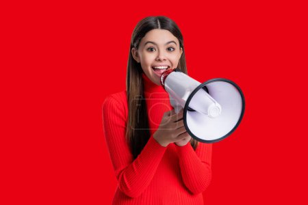 Teen girl announcer promote idea. Teen girl with loudspeaker isolated on red. Sale announcement. Announce advertisement. Hurry up. Season sale. Promotion offering of sale. Advertisement offer.