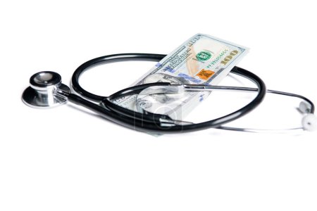 photo of medicine expenses currency banknote. medicine expenses concept. money for medicine expenses in selective focus. stethoscope of medicine expenses isolated on white background.