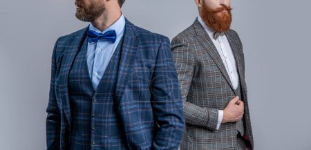 Tuxedo men wear formalwear fashion. Elegant men in menswear with bowtie. Two businessmen at business event. Tuxedo men in formalwear isolated on grey. Tuxedo men in formalwear. Cropped view.