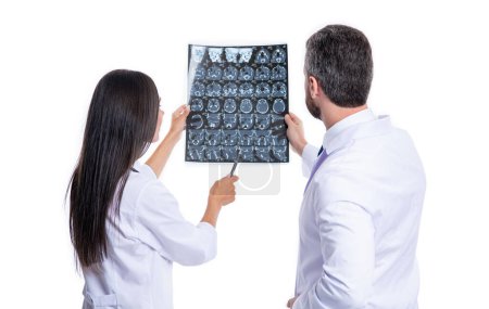 doctor in hospital looking at xray film healthcare, roentgen. medic in medical gown hold xray brain by radiographic. doctor hold xray isolated on white. doctor neurologist with xray scan. MRI images.