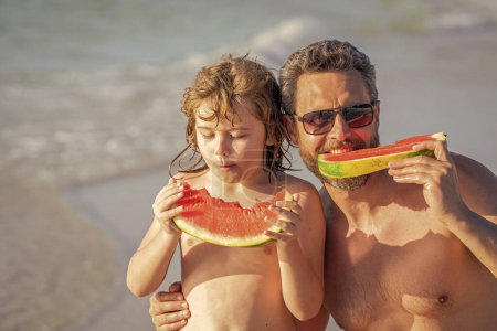 daddy dad and son on summer vacation. single dad with son at beach. being together. dad father and son kid enjoying quality time together at sea. dad and son hold healthy watermelon. family support.