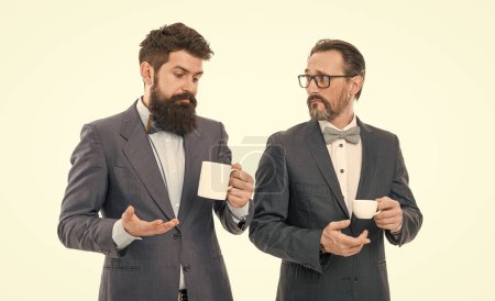 coffee break. Good morning. businessmen in formal suit with drink. business lunch. partners celebrate start up business. bearded men hold tea and coffee cup. Taking time to enjoy this morning.