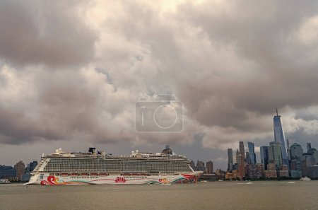 Photo for New York, USA - July11, 2023: Cruise ship Norwegian Joy Sailing next to Manhattan in New York. Skyline of New York Manhattan cruising on the Hudson River cruise liner NCL. - Royalty Free Image