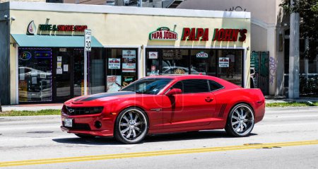 Photo for Miami Beach, Florida USA - April 15, 2021: red Chevrolet Camaro SS 2019 muscle car, side view. - Royalty Free Image