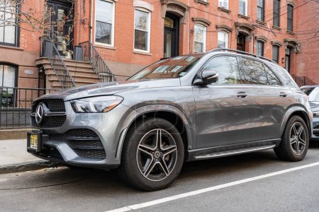 Photo for New York City, USA - March 31, 2024: Mercedes Benz GLE 580 4Matic SUV car parked outside, corner view. - Royalty Free Image
