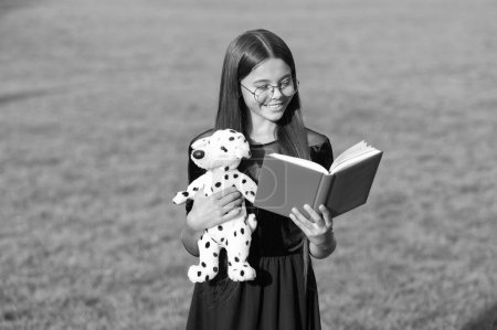 childhood education of teen girl with toy and book. childhood education of teen girl outdoor. image showing childhood education of teen girl. childhood education of teen girl.