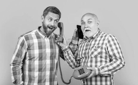 men with telephone contrast call in yellow studio. men with telephone contrast call on background. photo of men with telephone contrast call. men with telephone contrast call isolated on yellow.