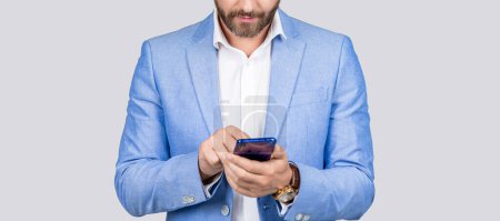 Photo for Man phone conversation in studio. Middle aged hispanic business man with phone. Business communication. Casual business man chatting on phone isolated on grey. Businessman using phone to reply. - Royalty Free Image