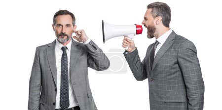 businessmen ignore shouting in megaphone isolated. businessmen ignore shouting in megaphone at studio. businessmen ignore shouting in megaphone. two businessmen ignore shouting in megaphone.