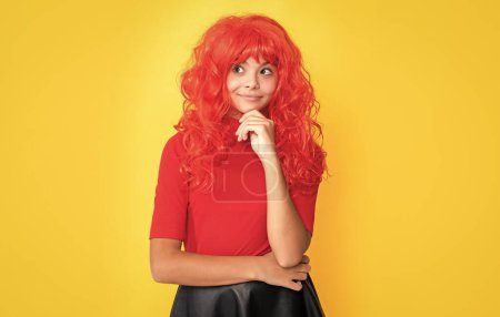 positive girl with red long hair on yellow background.