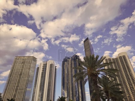 High-rise buildings modern urban architecture on cloudy sky in Sunny Isles, USA.