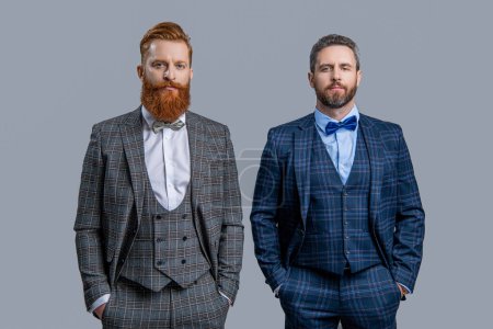 Tuxedo men in menswear isolated on grey. Tuxedo men in menswear. Tuxedo men wear menswear fashion. Elegant men in formalwear with bowtie. Two businessmen at business event. Classic style.