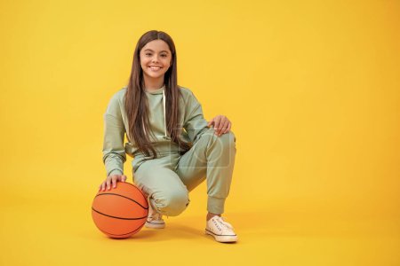 Teen girl excelling in basketball. teen girl basketball player. Passionate about basketball sport. Teen sport girl. Teen girl love the sport game of basketball. fun childhood sports.