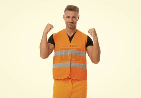 positive worker man wearing working reflective vest. studio shot of man worker. successful mature man worker isolated on white. worker man in orange uniform.