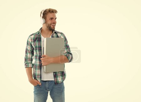 photo of millennial man student with laptop, copy space. millennial man student isolated on white. millennial man student on background. millennial man student in studio.