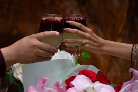 Photo for Engaged couple making toasts at their engagement - Royalty Free Image