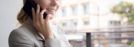 Photo for Beautiful young caucasian businesswoman sitting and talking on smartphone with relax in the office, business woman relax speaking on smart phone with confident, one person, communication concept. - Royalty Free Image
