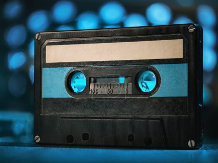 Téléchargez les photos : Audio cassette on a blue background - en image libre de droit