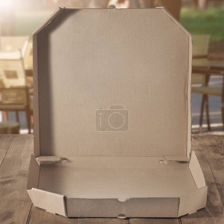 Photo for Empty pizza box on cafe table - Royalty Free Image
